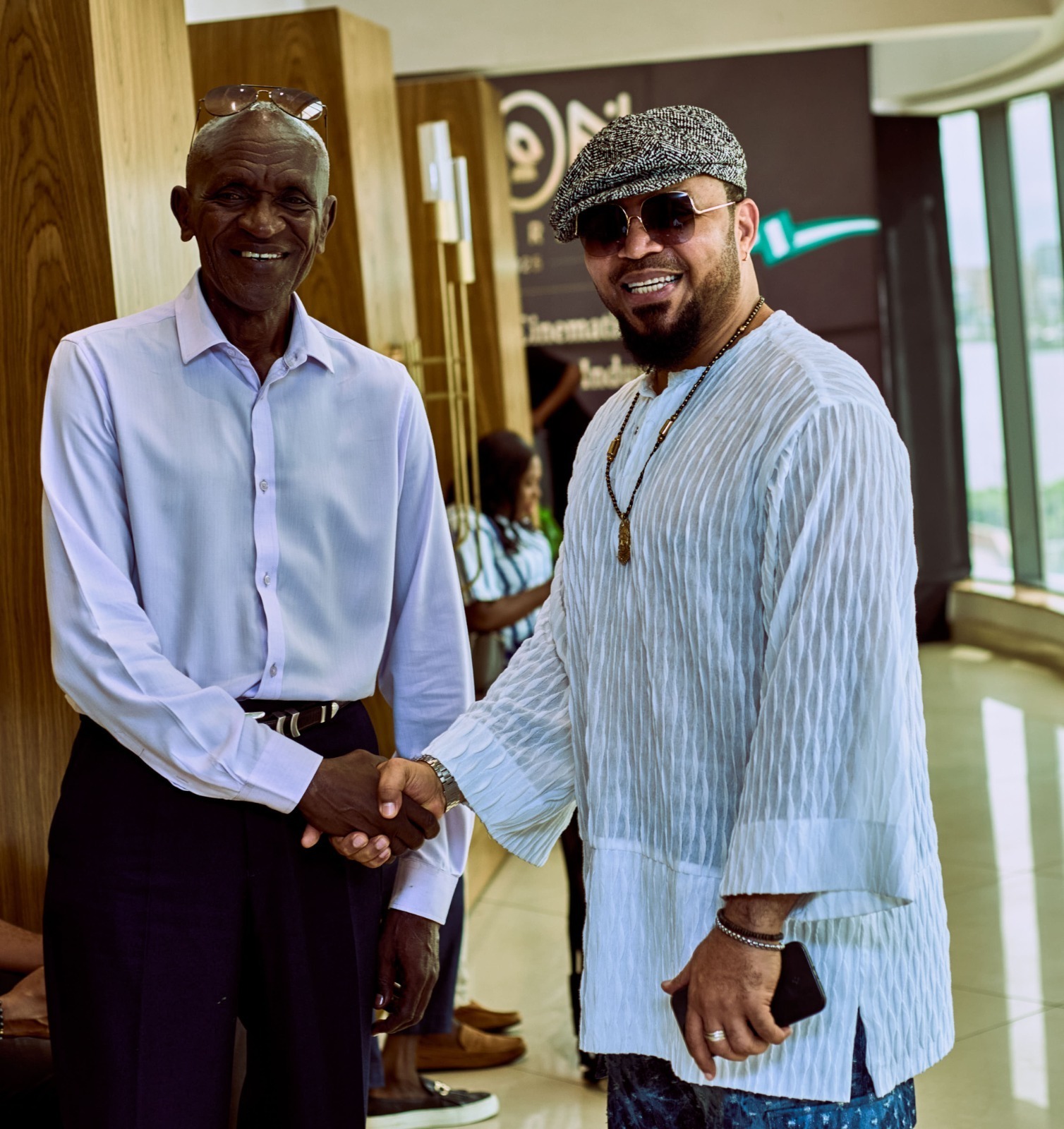 Seasoned actor and iKON Lifetime Achievement  Award winner Michael Wawuyo Sr. shakes hands with Nigerian actor and producer Ramsey Nouah during the iKON Activate in Nigeria last year.